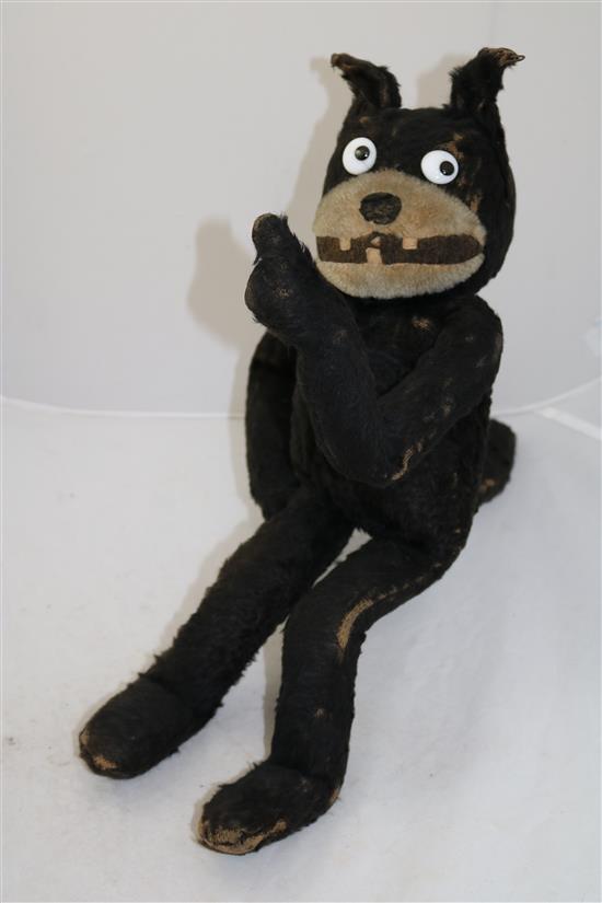 An early black plush straw filled model of Felix The Cat, 18in.